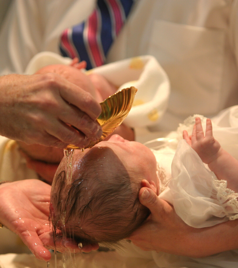 Close up on a baby being baptized