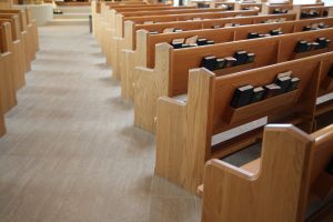 Pews in a church, with hymnals